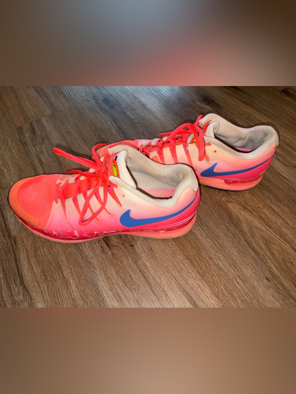 Nike Men's ' Pink/Coral Athletic Shoes with Blue Swoosh